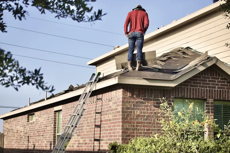 Professional roofer working on a residential roof in Northeast Santa Monica